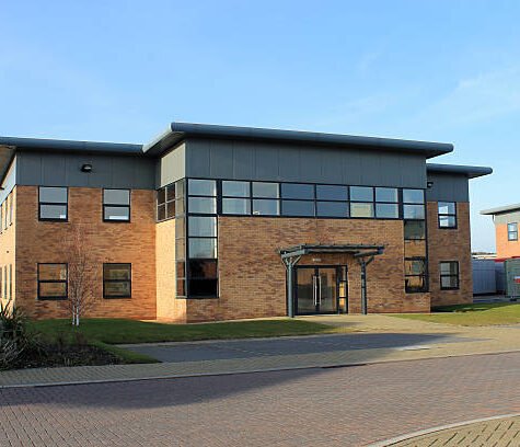 Exterior of empty modern office building to let on business park. Exterior of empty modern office building to let on business park.